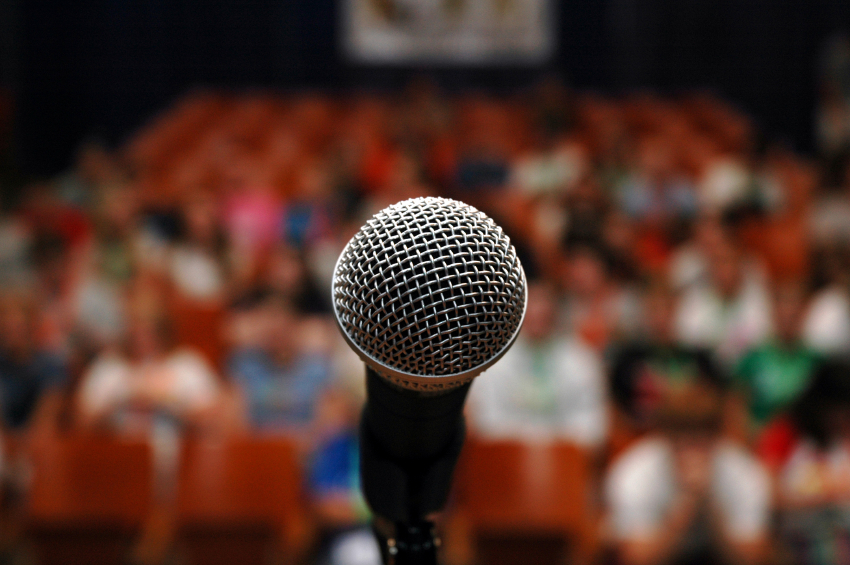 microphone in front of a very large audience