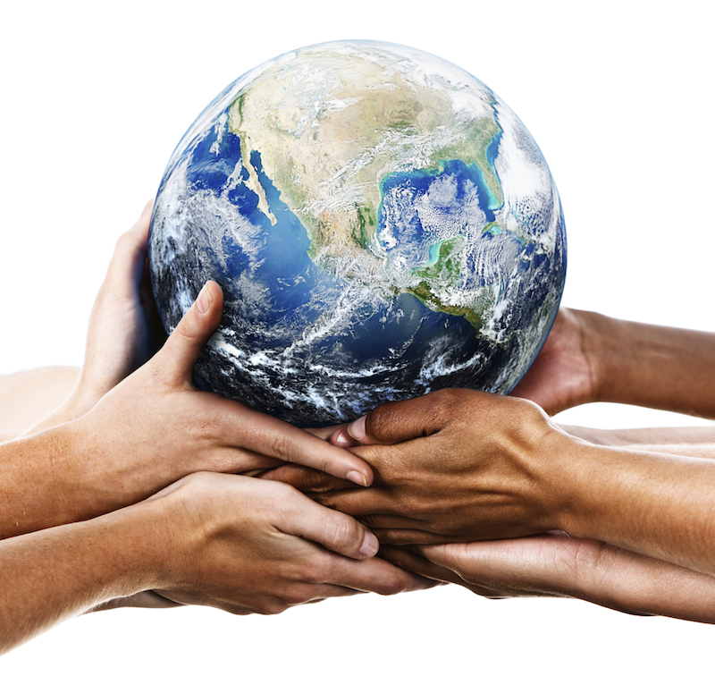 group of hands all holding up an earth globe