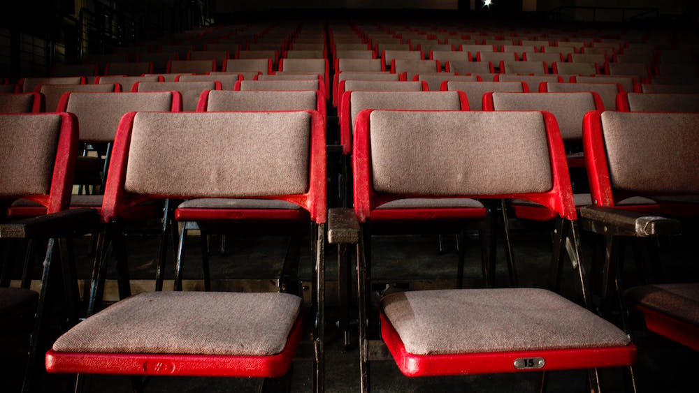 event chairs in front of a speaker's stage