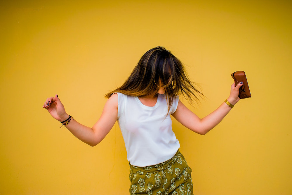 woman dancing joyously