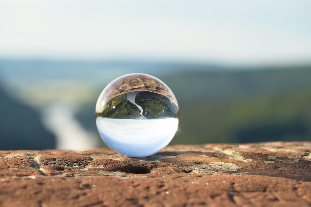 what to do if someone doesn't reply to your email: crystal ball sitting on the edge of a cliff