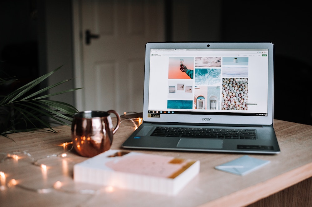 What should I blog about? laptop on a desk with a string of pretty lights