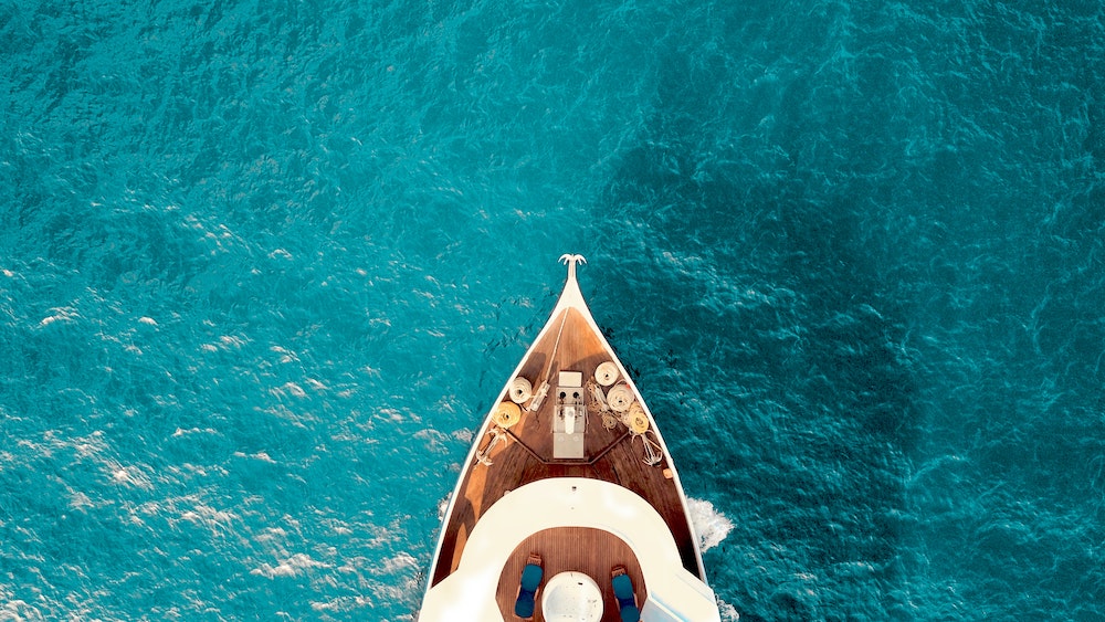 how to attract high paying clients - a yacht sailing the ocean blue