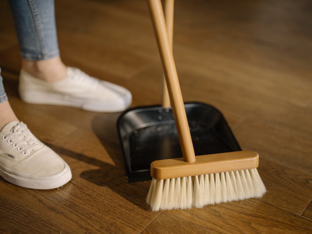 woman with dustpan