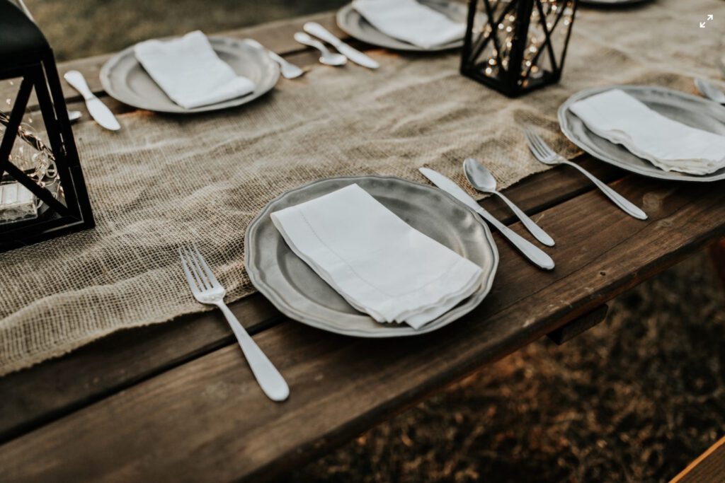 Plates and silverware before Thanksgiving dinner