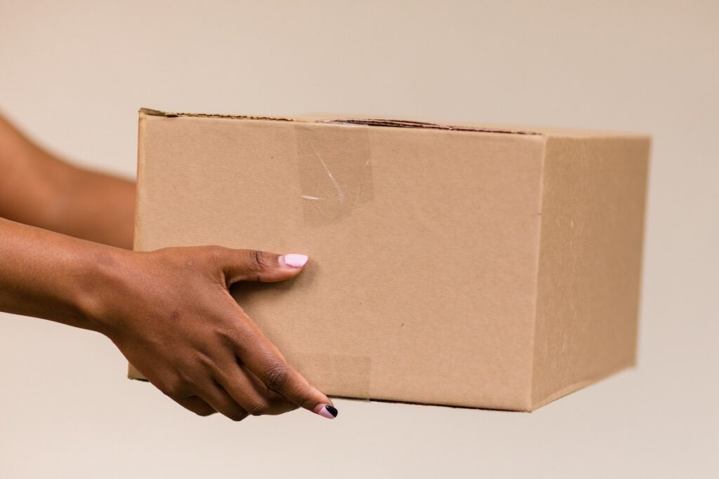 woman giving someone a care package