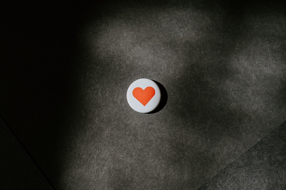 a single button with a heart on it