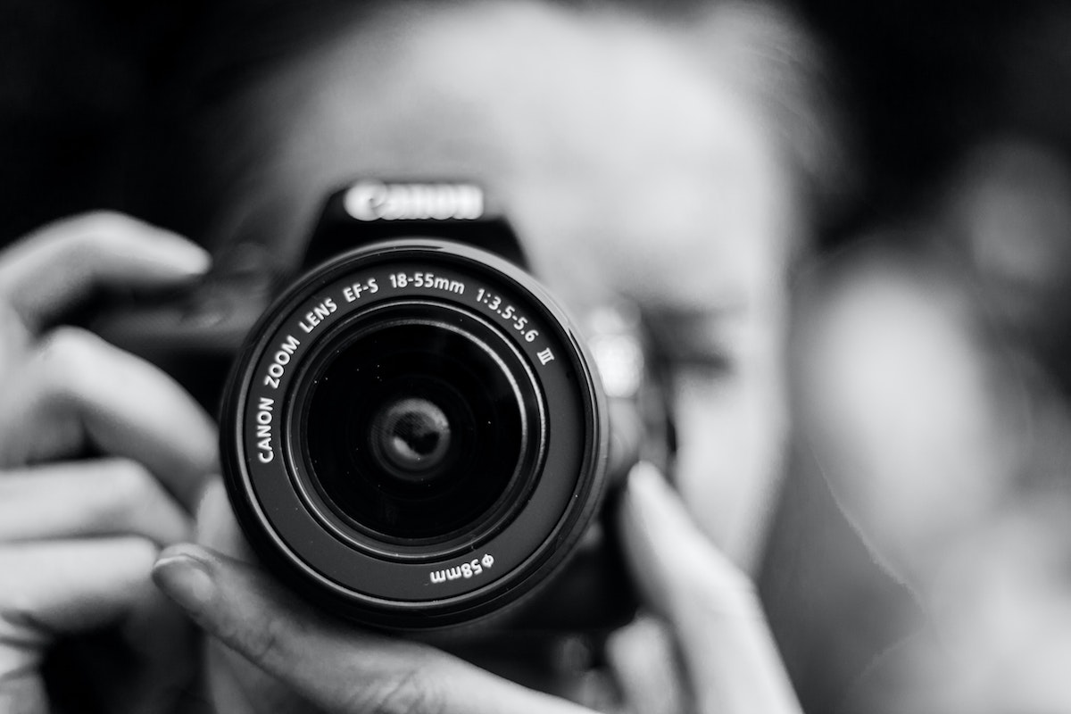 woman holding a professional camera