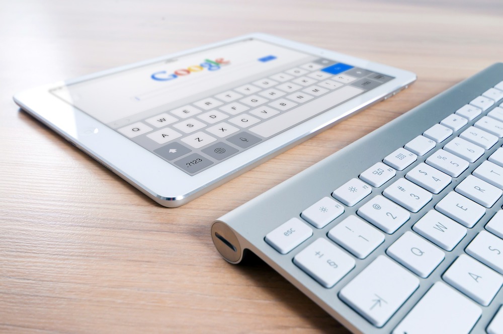 Benefits of WordPress - a keyboard with screen at Google