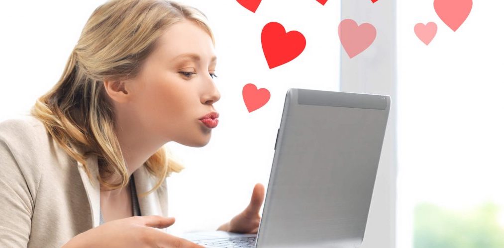 freshen up website - woman blowing her computer a kiss