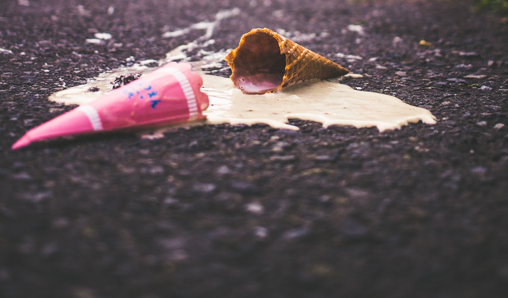 smashed ice cream cone mistake lying on the street