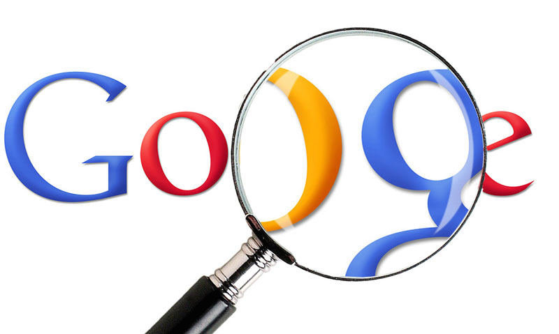 magnifying glass over the Google logo