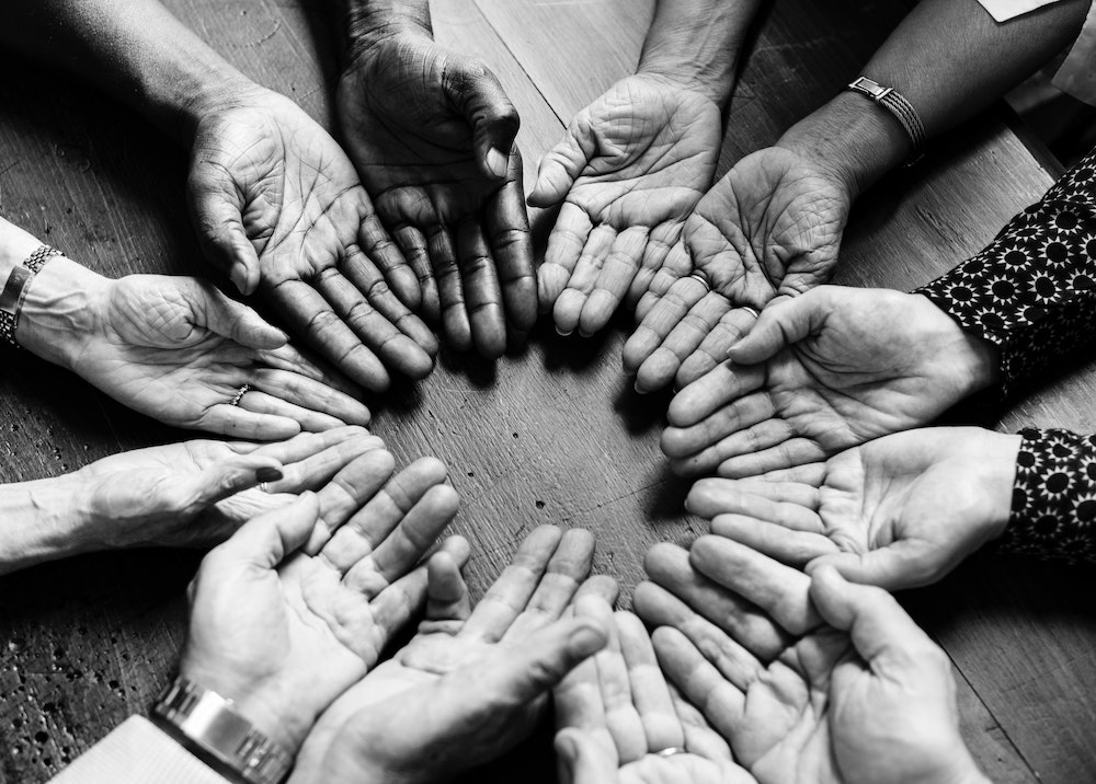 hands together in a circle teamwork