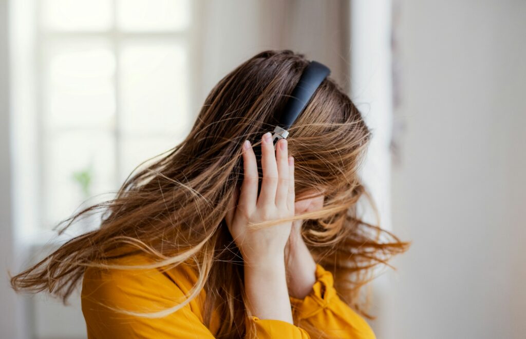 woman listening to music dancing with joy