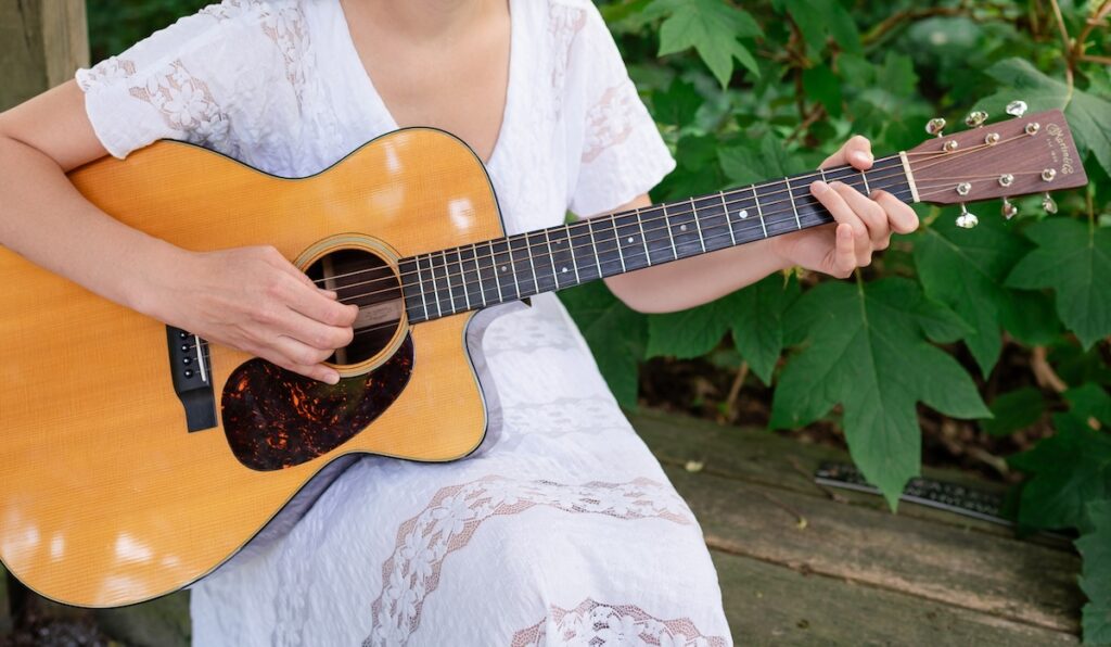 Janelle playing the guitar